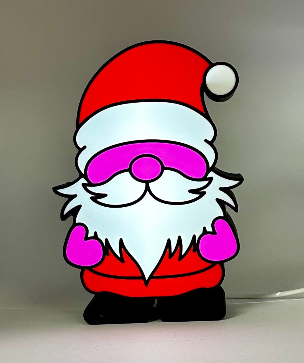 Lighted Christmas gnome decoration featuring a cheerful Santa-like figure with a bright red hat and fluffy beard.