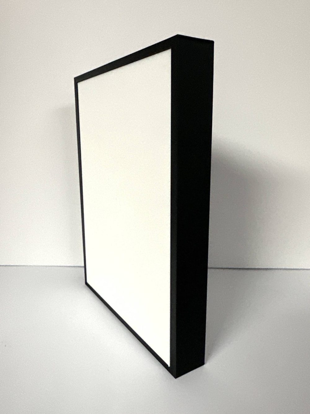 Rectangular lithophane frame before backlighting, showcasing its translucent and black border design.