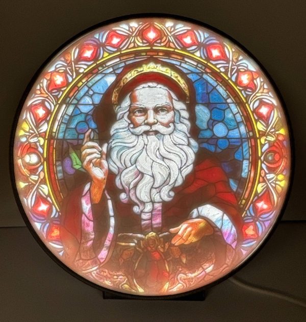 Ornate Santa Claus lithophane with vibrant stained glass-style design, illuminated from behind.