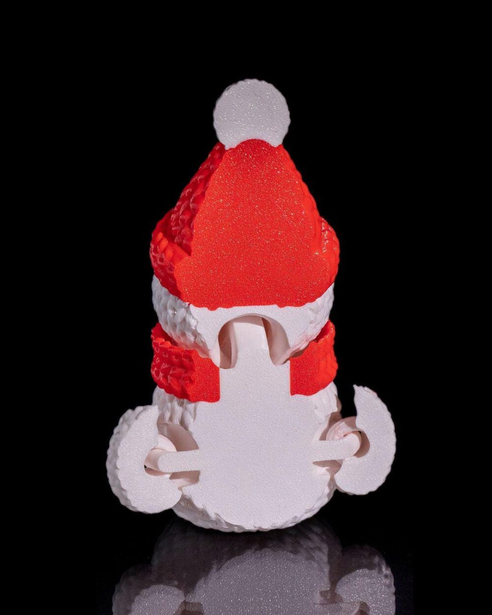 3D printed snowman decoration with a red Santa hat and scarf, displayed on a black background. Perfect Christmas home decor or unique holiday gift.