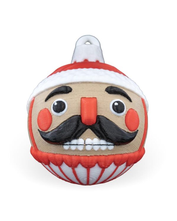 Handcrafted Nutcracker Christmas Ornament with red hat, black mustache, rosy cheeks on product page for festive holiday decoration.