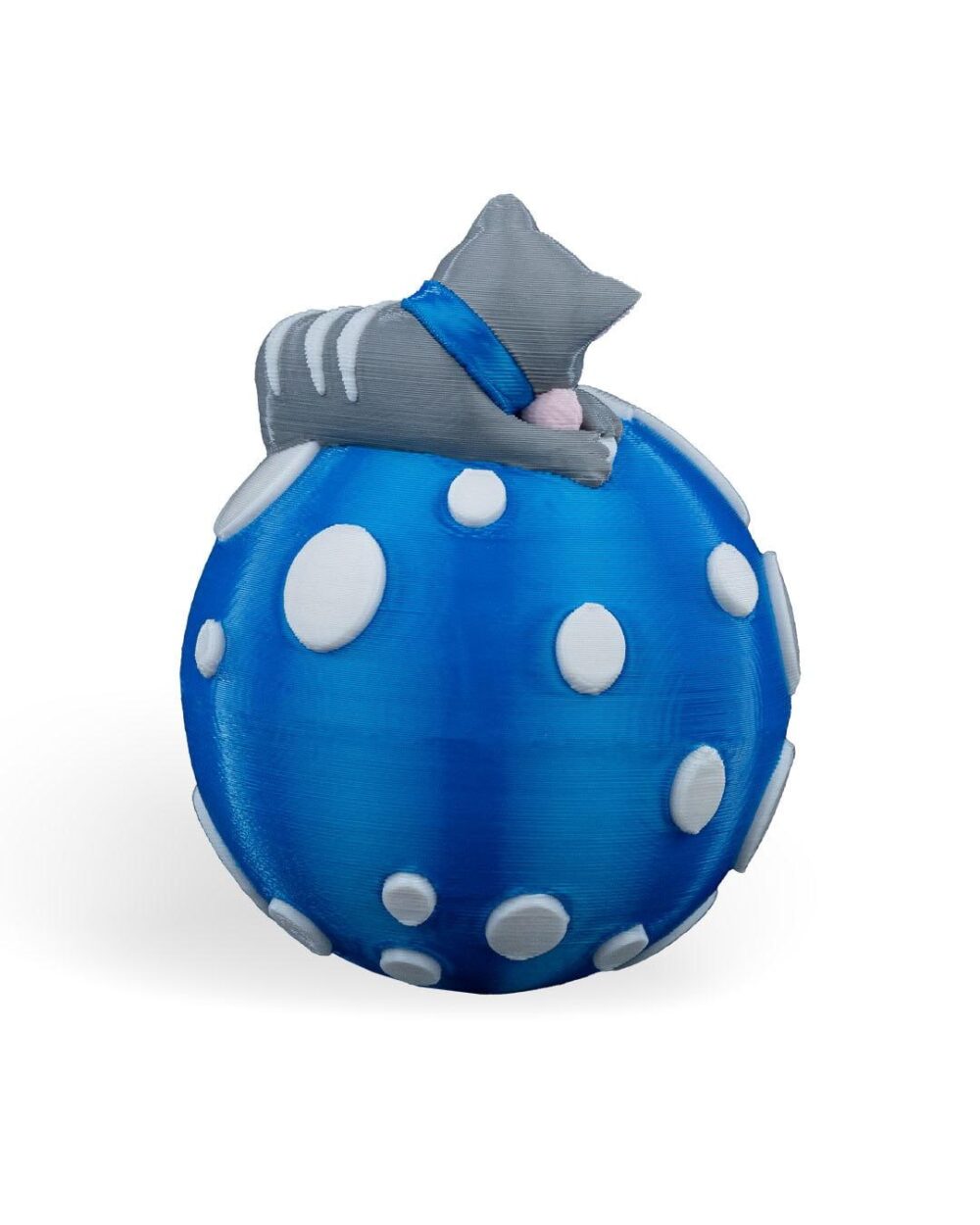 Handcrafted Sleeping Cat Christmas Ornament: gray cat with a blue scarf on a blue and white polka dot ball.