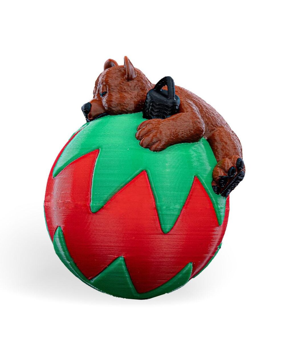 Handmade Charming Sleeping Bear Christmas Ornament. Adorable bear sleeping on a green and red festive ball, perfect for holiday decor.