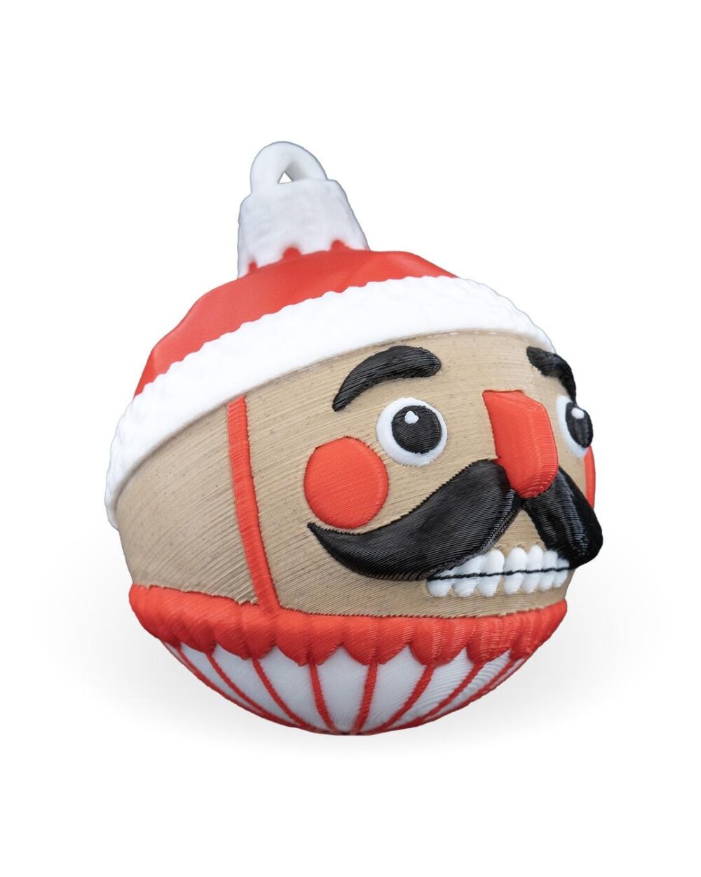 Handcrafted Nutcracker Christmas Ornament with red and white colors, featuring a traditional nutcracker face with mustache.