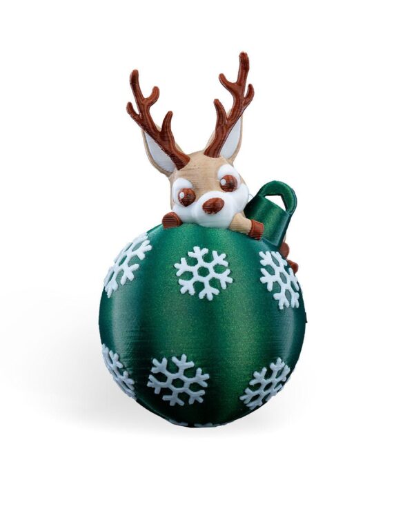 Handmade Lying Reindeer Christmas Ornament holding a green ball with white snowflakes – Unique Holiday Decoration.